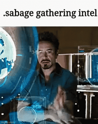 A Man In A Blue Shirt Is Standing In Front Of A Screen That Says Sabage Gathering Intel GIF