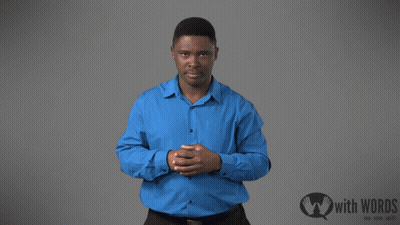 A Man In A Blue Shirt Is Standing In Front Of A Sign That Says " With Words " GIF