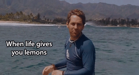 A Man In A Blue Shirt Is Standing In The Water With The Words " When Life Gives You Lemons " Written Below Him GIF