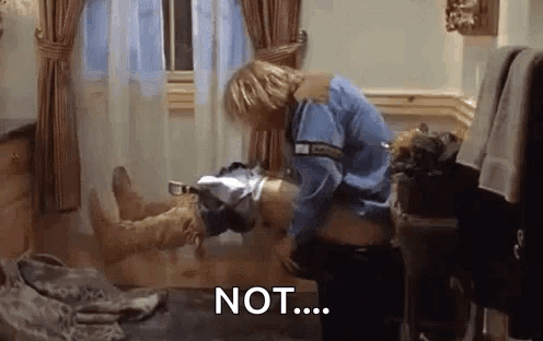 A Man In A Blue Shirt Is Standing Next To A Woman In A Bathtub With The Word Not Written On The Floor . GIF