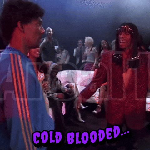 A Man In A Blue Shirt Is Standing Next To Another Man In A Red Jacket With The Words Cold Blooded Written On The Bottom GIF
