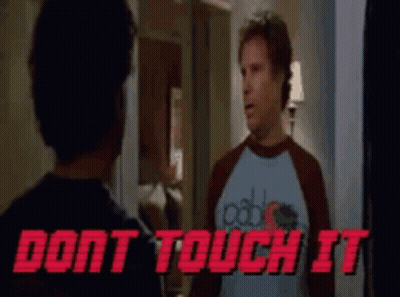 A Man In A Blue Shirt Is Standing Next To Another Man In A Red Shirt . GIF