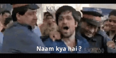 A Man In A Blue Shirt Is Surrounded By Police Officers And Shouting . GIF