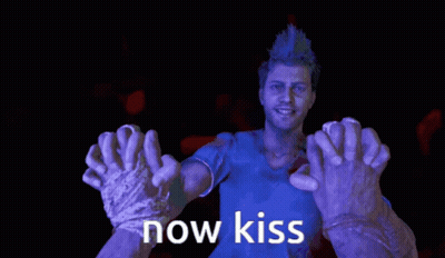 A Man In A Blue Shirt Is Surrounded By Purple Hands That Say " Now Kiss " GIF