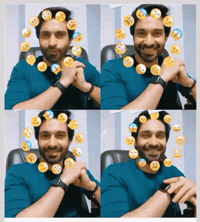 A Man In A Blue Shirt Is Surrounded By Smiley Faces On His Head GIF