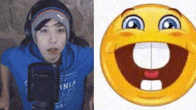 A Man In A Blue Shirt Is Talking Into A Microphone Next To A Smiley Face With A Big Mouth And Teeth . GIF