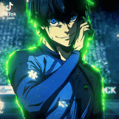 A Man In A Blue Shirt Is Talking On A Cell Phone With A Green Background GIF