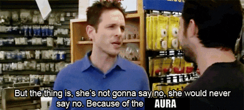 A Man In A Blue Shirt Is Talking To Another Man In A Hardware Store GIF
