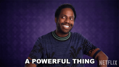 A Man In A Blue Shirt Says " A Powerful Thing " In Front Of A Purple Background GIF