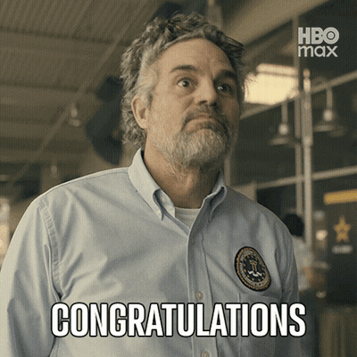 A Man In A Blue Shirt Says Congratulations In Front Of A Hbo Max Logo GIF