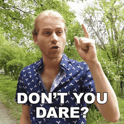 A Man In A Blue Shirt Says " Do N't You Dare " With His Finger Up GIF