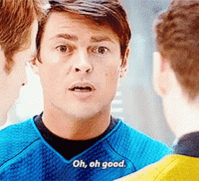 A Man In A Blue Shirt Says Oh , Oh Good While Talking To Two Other Men . GIF