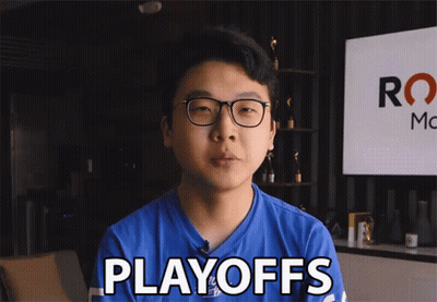 A Man In A Blue Shirt Says Playoffs In Front Of A Sign GIF