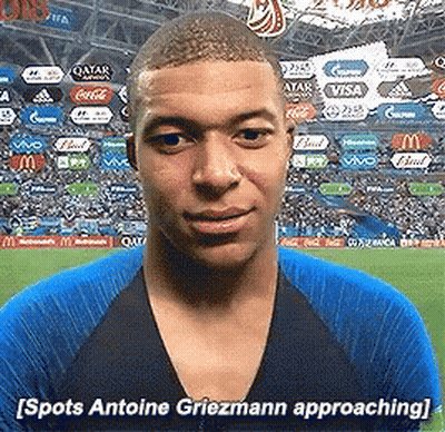 A Man In A Blue Shirt Says Spots Antoine Griezmann Approaching In Front Of A Crowd GIF