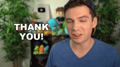 A Man In A Blue Shirt Says Thank You With His Eyes Closed GIF