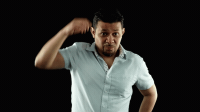 A Man In A Blue Shirt Scratches His Head With His Hand GIF