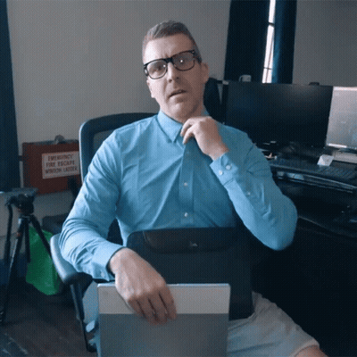 A Man In A Blue Shirt Sits In Front Of An Emergency Window Ladder GIF