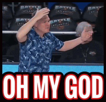 A Man In A Blue Shirt Stands In Front Of A Banner That Says Oh My God GIF