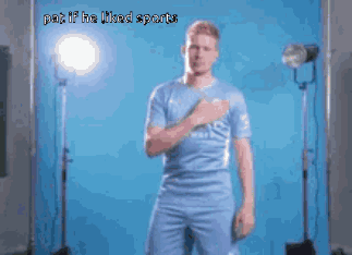A Man In A Blue Shirt Stands In Front Of A Blue Background With The Words " Put If He Liked Sports " On The Bottom GIF