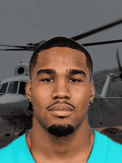 A Man In A Blue Shirt Stands In Front Of A Helicopter That Says ' A ' On It GIF