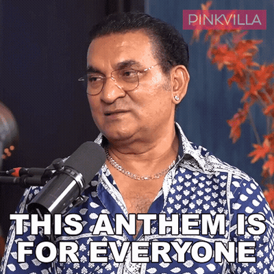 A Man In A Blue Shirt Stands In Front Of A Microphone And Says This Anthem Is For Everyone GIF