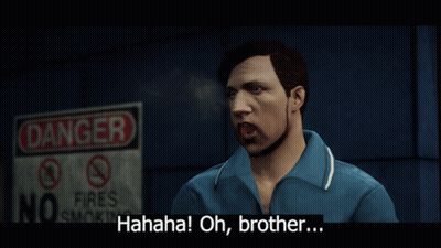 A Man In A Blue Shirt Stands In Front Of A Sign That Says Danger GIF