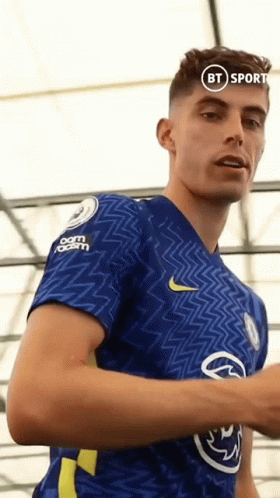 A Man In A Blue Shirt With A Bt Sport Logo On His Chest GIF