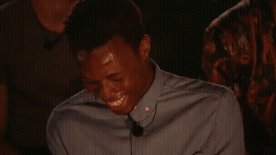 A Man In A Blue Shirt With A Microphone On His Neck GIF