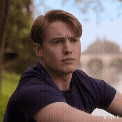 A Man In A Blue Shirt With A Netflix Logo On The Bottom GIF