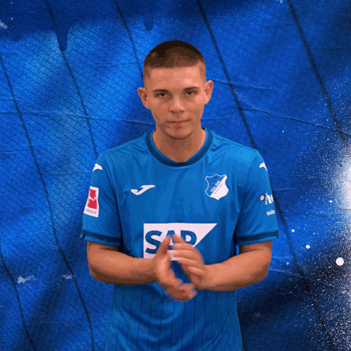 A Man In A Blue Shirt With Sap On It GIF