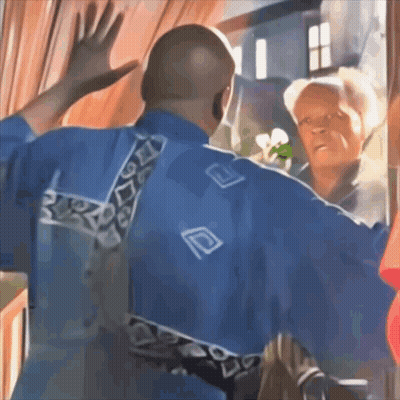 A Man In A Blue Shirt With The Letter D On The Back Is Waving GIF