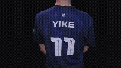 A Man In A Blue Shirt With The Name Yike On The Bottom GIF