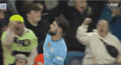 A Man In A Blue Shirt With The Word City On It Is Surrounded By A Crowd GIF