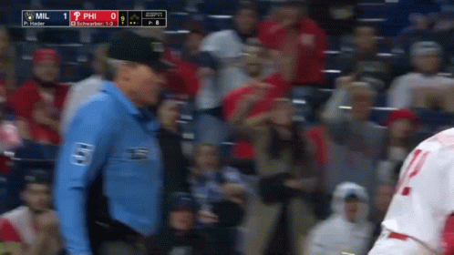 A Man In A Blue Shirt With The Word Mil On It GIF