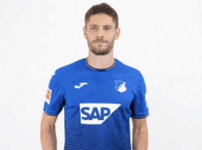 A Man In A Blue Shirt With The Word Sap On It Gives Two Thumbs Up GIF