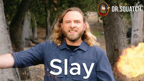 A Man In A Blue Shirt With The Word Slay On His Shirt GIF
