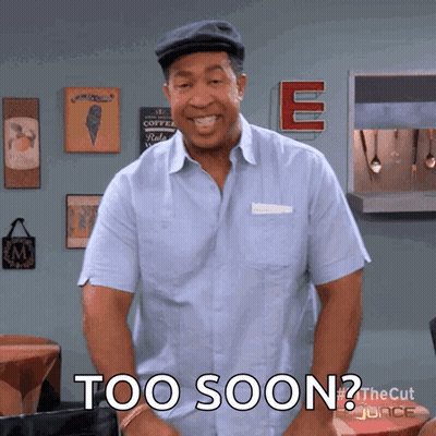 A Man In A Blue Shirt With The Words Too Soon On His Chest GIF
