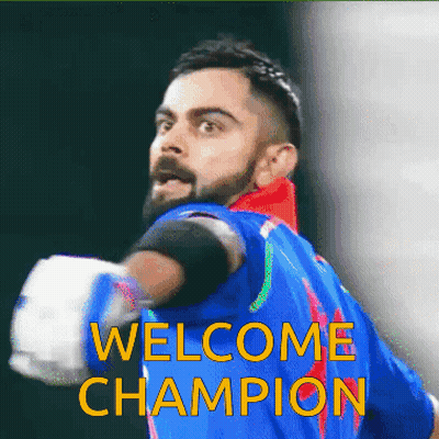 A Man In A Blue Shirt With The Words Welcome Champion Written On It GIF