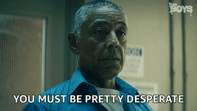 A Man In A Blue Shirt With The Words " You Must Be Pretty Desperate " Next To Him GIF