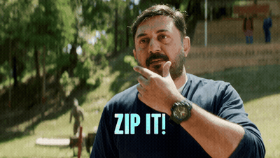 A Man In A Blue Shirt With The Words Zip It On It GIF