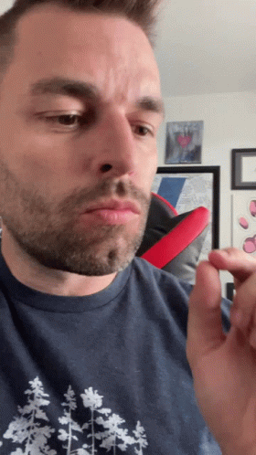 A Man In A Blue Shirt With Trees On It GIF