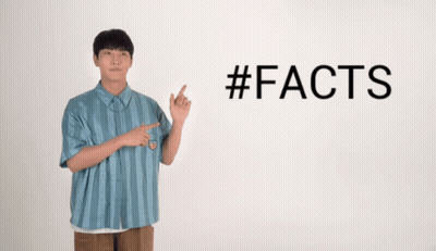 A Man In A Blue Striped Shirt Points To The Word #Facts GIF