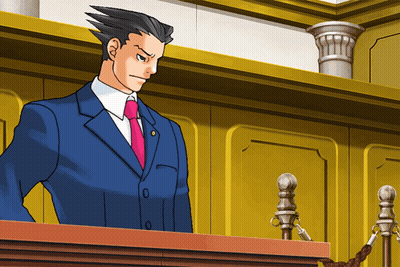 A Man In A Blue Suit And Pink Tie Is Standing At A Podium GIF