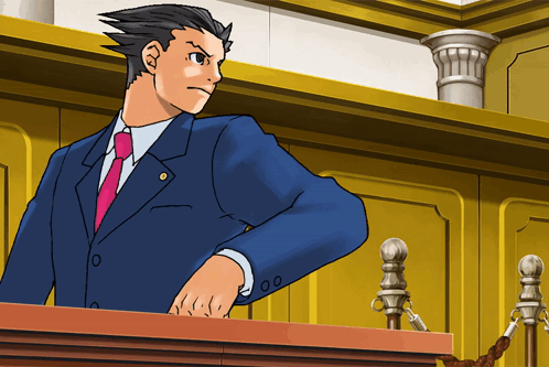 A Man In A Blue Suit And Pink Tie Stands At A Podium GIF