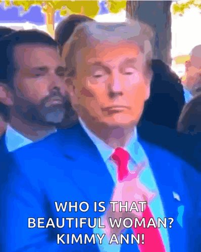 A Man In A Blue Suit And Red Tie Is Asking Who Is That Beautiful Woman Kimmy Ann GIF