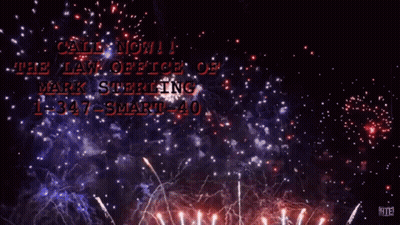 A Man In A Blue Suit And Red Tie Stands In Front Of Fireworks And Says Call Now At The Law Office Of Mark Sterling GIF