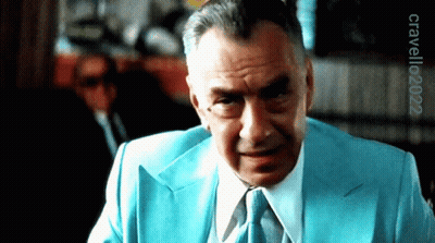 A Man In A Blue Suit And Tie Has The Year 2022 On The Bottom GIF