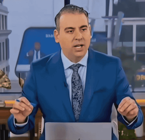 A Man In A Blue Suit And Tie Stands In Front Of A Screen That Says Dr. GIF