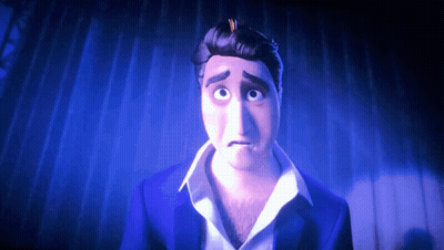 A Man In A Blue Suit And White Shirt Is Looking At The Camera GIF