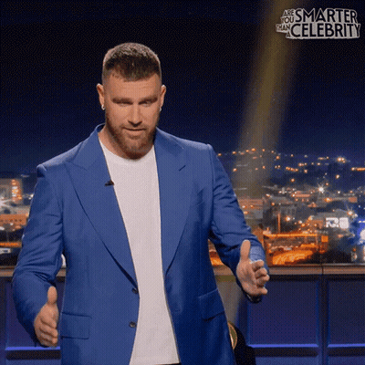 A Man In A Blue Suit Giving A Thumbs Up GIF